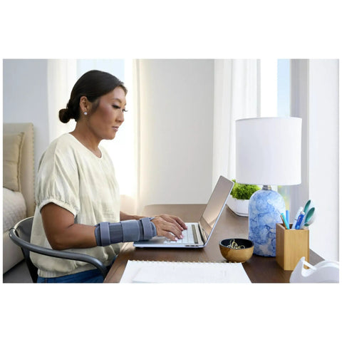 Woman typing wearing Carpal Tunnel Wrist Stabilizer For All Day Comfort And Support Adjustable Wrist Brace With Memory Foam Palm Comfy Fit
