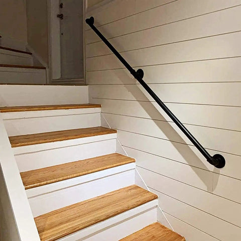 Heavy Duty Black Iron Wall Bracket Kit For Deck Railing With Beefy Guardrail Support And No Sweat Homeowner Assembly Adjustable Span For Indoor Outdoor Projects Game Changer Backyard Upgrade displayed on wooden stairs.