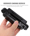 Heavy Duty Built Tough Invisible Door Hinge With 3D Adjustable Metal Cross Hinge And 180 Degree Swing Supports 40kg Load Concealed Door Hardware For Wooden Doors And Frames Left Or Right Opening shown in hand.
