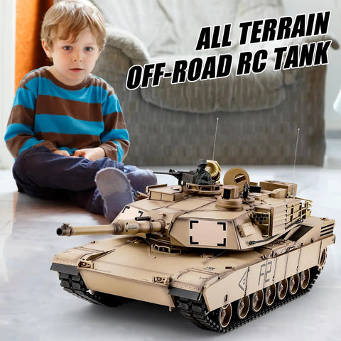 Child sitting next to 1 By 16 Scale M1A2 Abrams RC Tank With Realistic Sound And Lights, 2.4GHz Remote Control, Off Road Model