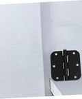 Black iron rounded-corner door hinge mounted on a light gray cabinet door