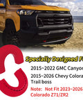 Red Tow Hook Cover for 2015-2026 Chevy Colorado Trail Boss and 2015-2022 GMC Canyon shown on truck front on beach
