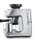 Certified Remanufactured Automatic Espresso Machine With Built In Grinder And Steam Wand, sleek silver design with milk frother.