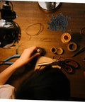 100 Piece Mini Machine Screws For Furniture Repair And DIY Projects Rock Solid Tiny Fasteners on a wooden work table with tools.