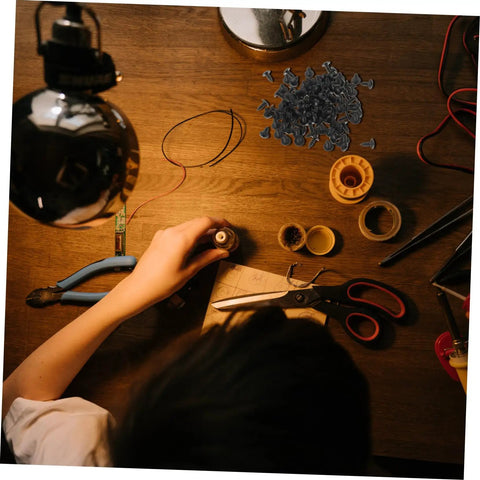100 Piece Mini Machine Screws For Furniture Repair And DIY Projects Rock Solid Tiny Fasteners on a wooden work table with tools.