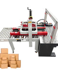 Automatic Carton Sealer And Strapper All In One Box Packing Station Adjustable 120 To 500Mm with stacks of cardboard boxes.