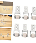Six Piece Set Of One Inch White Nylon Sliding Roller Guide Wheels For Heavy Duty Furniture And Cabinet Drawer Tracks featuring smooth casters.