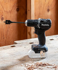 Subcompact Cordless Drill Driver With Brushless Power, 18V LXT, Half-Inch Chuck, Dual Speed in workshop with spade bit