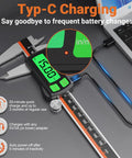 Type-C Rechargeable Digital Caliper With Stainless Steel Vernier, Large Backlit LCD, USB Charging next to laptop on desk.