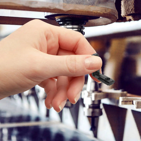 Hand holding Heavy Duty Zinc Alloy 90 Degree L Brackets For Dead Nuts Secure Corner Mounting in a workshop setting.