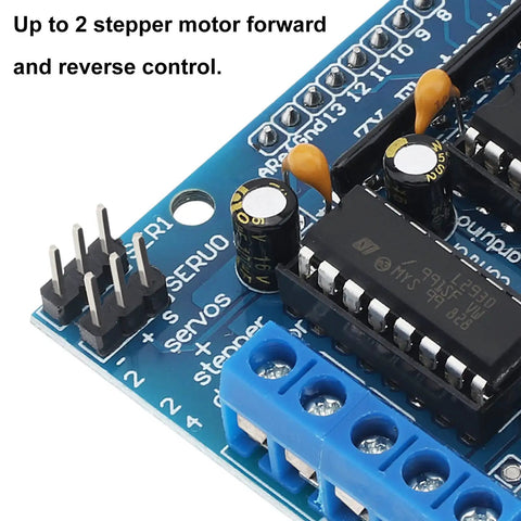 Close-up of 4 Way L293D DC Motor Driver Shield For Arduino Uno Mega Raspberry Pi, showing pin and capacitor components.