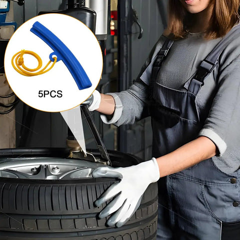 Woman in gloves using Universal 5 Piece Car Tire Mounting Guards Wheel Rim Edge Protectors on a tire for scratch prevention.