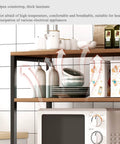 Kickass Heavy Duty Kitchen Storage Rack Handling Everyday Essentials From Microwaves To Pantry Items, featuring open countertop with thick laminate.