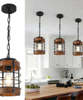 Black Farmhouse Pendant Lights for Kitchen Island, 1-Light Metal Cage Rustic Wood Pendant Light Fixtures, hanging over a kitchen island.