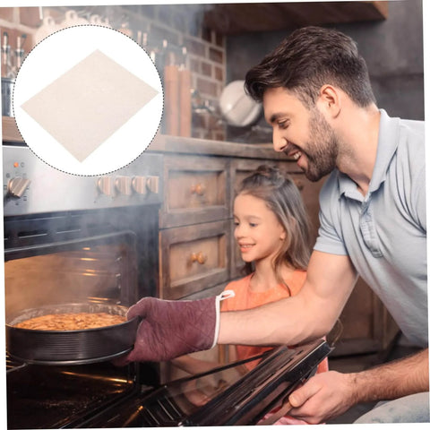 Man baking with daughter while using Ten Piece Microwave Mica Sheets For Oven Insulation And Heat Resistant Shield Reusable Mica Plates