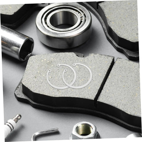 5 Piece Stainless Steel C Clip Retaining Ring Kit for Grooved Shafts shown with mechanical parts and tools