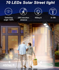 Super Bright 200W Solar Street Lights Outdoor With Motion Sensor Dusk to Dawn Waterproof Flood Lights illuminating a walkway.