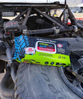 AutoSCRUB Cleaning Wipes Heavy Duty 60 Count Cleaning Cloths 15 By 10 Inches on a vehicle tire with engine in background