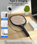 Electric Fly Swatter Zapper Racket 4000V Beast Mosquito Killer With LED Light for Indoor and Outdoor Use charging via USB-C next to a laptop.