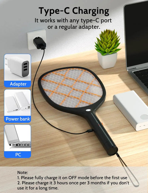 Electric Fly Swatter Zapper Racket 4000V Beast Mosquito Killer With LED Light for Indoor and Outdoor Use charging via USB-C next to a laptop.