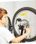 Child adjusting Heavy Duty Mountain Bike Disc Brake Kit With Front And Rear 160Mm Rotors Mechanical Caliper in a garage.