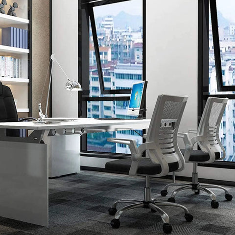 Modern office with swivel chairs using M8x125 Threaded Stem One Point Five Inch Nylon Swivel Caster Wheels With Brake for smooth movement.