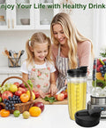 Mother and daughter in kitchen with 32 Ounce Blender Cups Replacement Durable With Sip And Seal Lids For Ninja Blenders on counter.