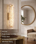AooLiWang Gold LED Wall Sconces, Set of 2 with Transparent Glass Strip modern design in living room setting.