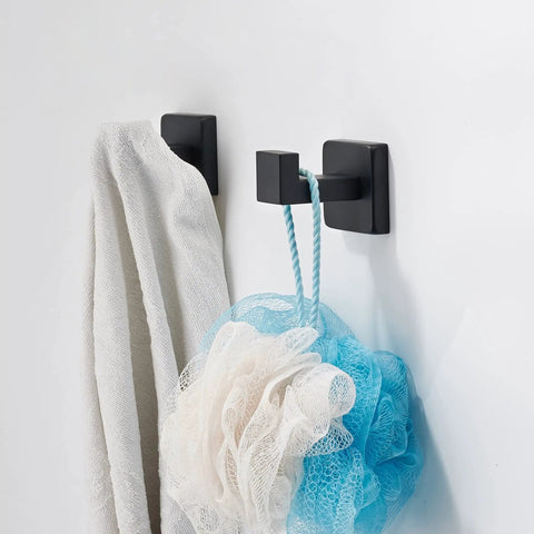 Hefty Matte Black Wall Mount Coat Hook Set Stainless Steel Solid Grip Rack with towel and loofah in bathroom.