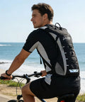 Man cycling with Lightweight Running Vest With Adjustable Chest Pack And Pistol Holster Hydration Vest With 1.5L Bladder
