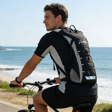 Man cycling with Lightweight Running Vest With Adjustable Chest Pack And Pistol Holster Hydration Vest With 1.5L Bladder