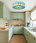 Vintage Tiffany Style Mermaid Glass Ceiling Light in blue finish, 11.8 inch, illuminating a cozy kitchen setting.
