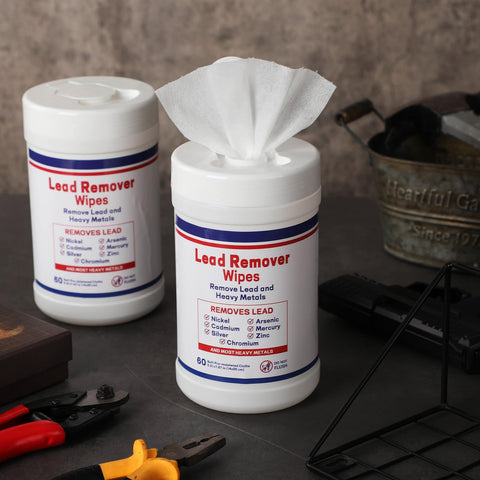 Lead Remover Wipes For Shooting 2 Pack 120 Wipes Hand And Surface Cleaning Wipes canisters on a workshop table.