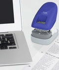 Desktop Staple Free Stapler That Zips Through Up To 10 Pages Without Staples Bright Blue Finish next to a laptop on a desk