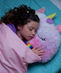 Child sleeping with Rainbow Unicorn 2-In-1 Pillow and Sleep Sack, Cozy Nap Buddy for Travel and Sleepovers, Lightweight 54x20 Play Pillow