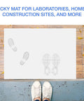 Rock Solid Adhesive Floor Mats 4 Pack Grip Tight Cleanroom Traps With Peel Back Tack Sheets For Construction Sites near shoe prints on a clean surface.