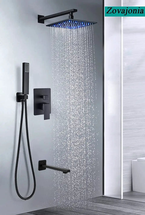 LED Rain Shower System With High Pressure 12 Inch Square Rain Head Handheld Shower Brass Tub Spout Brass Shower Arm Stainless Steel Hose 3 Function Valve Matte Black Bath Faucet Trim Kit Luxury Bathroom Rain Mixer Set installed in a modern bathroom showing water flow from shower head.