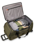Briggs & Riley 27in medium upright duffle in olive green fabric with wheels; opened to show interior pockets.