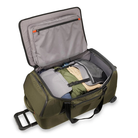 Briggs & Riley 27in medium upright duffle in olive green fabric with wheels; opened to show interior pockets.