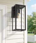 Close-up of installed 2 Pack 15 Inch Outdoor Wall Sconces With Clear Glass No Fuss Black Finish Weather Resistant Exterior Lanterns.