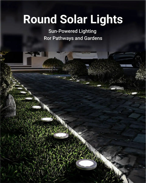 Round solar lights illuminating a garden pathway at night, showcasing 12 Pack Solar Path Lights Outdoor LED Garden Lights Waterproof.