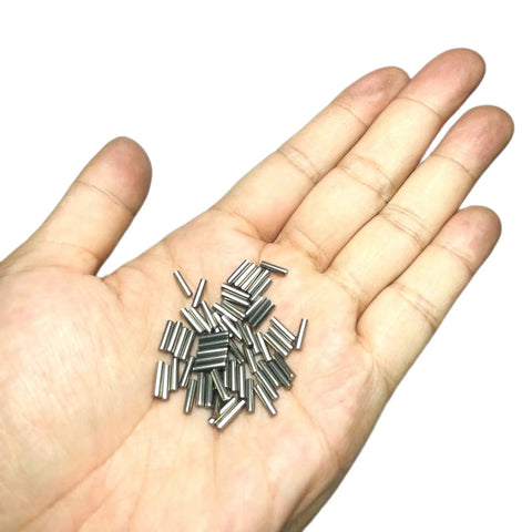 Built Tough Precision Ground 2mm X 10mm Dowel Pins 60 Pack stainless steel dowel pins in hand, showing heavy duty design.