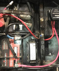 Heavy Duty 12V 140A Voltage Sensitive Relay Vsr Dual Battery Isolator installed in truck battery compartment with wiring.