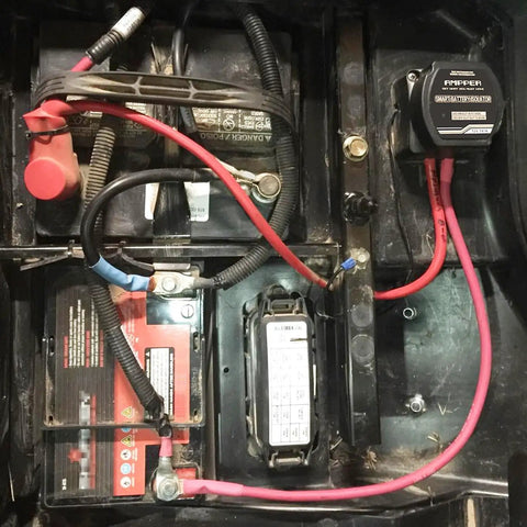 Heavy Duty 12V 140A Voltage Sensitive Relay Vsr Dual Battery Isolator installed in truck battery compartment with wiring.