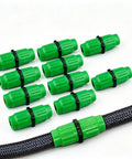 Top Tier Expandable Garden Hose Repair Kit With Leak-Free Female Male Plastic Connectors For Quick Flexible Tube Fixes On Pocket Flexi And Retractable Hoses Up To 1/2 Inch For Super Easy Yard Maintenance And Zero Drip Hassle; green plastic hose couplers on a black hose