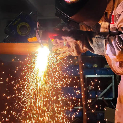 Pro Grade P80 Plasma Cutter Consumables Kit 45 pieces in action cutting steel with sparks flying, 80A system use