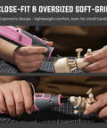 User holding the Pink 4V Cordless Rotary Tool Kit With Seventy Heavy Duty Bits and Slick Engraving Handle for precise wood carving.