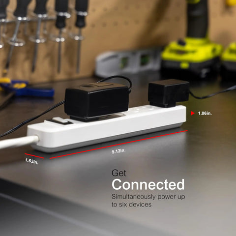 Six Outlet Power Strip With 12 Ft Extension Cord And Flat Plug Grounded With Integrated Circuit Breaker 3 Prong Wall Mount ETL Listed White Finish placed on workbench