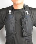 Lightweight Hands-Free Hydration Vest For Hiking And Trail Running, 2L Water Bladder, Nylon TPU Pack on person in black outfit