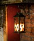 Outdoor Hanging Solar Lanterns Waterproof LED Lights For Porch Garden Patio Pathway Deck Yard Bronze Finish Two Pack No Fuss Auto On At Night With Upgraded Solar Panel And 600mAh NiMH Battery. Bronze lantern hanging on brick wall.
